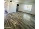 Bright living room features wood-look flooring and a large window at 7126 N 19Th Ave # 224, Phoenix, AZ 85021