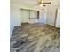 Spacious living area with stylish wood-look flooring and a view of the landing at 7126 N 19Th Ave # 224, Phoenix, AZ 85021