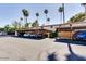 Exterior view of an outdoor community parking lot with mature palm trees at 7126 N 19Th Ave # 224, Phoenix, AZ 85021