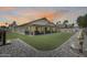 Wonderful backyard featuring artificial turf, a covered patio, and a cozy fire pit area at 7253 S Terrace Rd, Tempe, AZ 85283