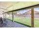 Covered patio and backyard with artificial grass at 7253 S Terrace Rd, Tempe, AZ 85283