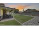 Grassy backyard with a covered patio perfect for relaxing or entertaining at 7253 S Terrace Rd, Tempe, AZ 85283