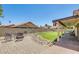Backyard featuring low-maintenance yard with pavers, artificial grass and rock ground cover at 7253 S Terrace Rd, Tempe, AZ 85283