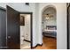 Bathroom featuring a toilet and sink, with an arched doorway leading to the primary bedroom at 7253 S Terrace Rd, Tempe, AZ 85283