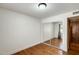 Bright bedroom features hardwood floors, large closet with mirror doors, and neutral paint at 7253 S Terrace Rd, Tempe, AZ 85283