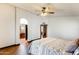 Spacious bedroom featuring a ceiling fan and connecting doors to the bathroom and hallway at 7253 S Terrace Rd, Tempe, AZ 85283