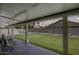 Inviting covered patio with string lights overlooking the artificial grass backyard at 7253 S Terrace Rd, Tempe, AZ 85283