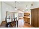 Open concept kitchen/dining room featuring hardwood floors, pendant lighting, and a breakfast bar at 7253 S Terrace Rd, Tempe, AZ 85283