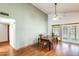 Inviting dining room features light green walls, wood floors, and plenty of natural light at 7253 S Terrace Rd, Tempe, AZ 85283