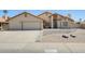 Charming single-story home featuring a well-maintained front yard, attached garage, and inviting entrance at 7253 S Terrace Rd, Tempe, AZ 85283