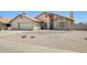 Attractive single-Gathering home showcases desert landscaping, a two-car garage, and covered entry at 7253 S Terrace Rd, Tempe, AZ 85283