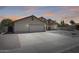 Attractive single-level home boasts a two-car garage and desert-style front yard at 7253 S Terrace Rd, Tempe, AZ 85283