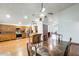 Open kitchen and dining area with wood cabinets, stainless steel appliances, and hardwood floors at 7253 S Terrace Rd, Tempe, AZ 85283