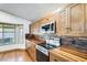 Gourmet kitchen featuring custom wood countertops, stainless appliances, and ample cabinet space at 7253 S Terrace Rd, Tempe, AZ 85283