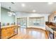 Open kitchen and dining area with wood floors and an abundance of natural light at 7253 S Terrace Rd, Tempe, AZ 85283