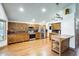 Spacious kitchen features wooden cabinets, stainless steel appliances, and wood-style flooring at 7253 S Terrace Rd, Tempe, AZ 85283