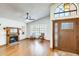 Bright living room boasts hardwood floors, arched windows, fireplace, and a stylish ceiling fan at 7253 S Terrace Rd, Tempe, AZ 85283