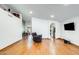 Open-concept living room with hardwood floors and easy access to kitchen and dining areas at 7253 S Terrace Rd, Tempe, AZ 85283