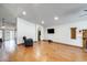 Open-concept living room with hardwood floors, fireplace, and wall mounted television at 7253 S Terrace Rd, Tempe, AZ 85283