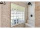 Modern shower with glass block window, tiled walls, and a built-in seating area at 7253 S Terrace Rd, Tempe, AZ 85283