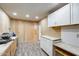 Bright workshop area features workbench, ample storage, and durable flooring for projects at 7253 S Terrace Rd, Tempe, AZ 85283
