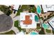 Stunning aerial view of a home featuring a red tile roof, a refreshing pool, and a well-manicured backyard at 7328 E Laredo Ln, Scottsdale, AZ 85250