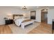 Serene bedroom featuring a woven headboard, contemporary lighting, and a neutral color palette at 7328 E Laredo Ln, Scottsdale, AZ 85250