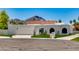 Modern home featuring white stucco, red tile roof and a view of a mountain in the background at 7328 E Laredo Ln, Scottsdale, AZ 85250