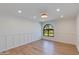 Bright living room featuring recessed lighting, board and batten trim and light wood flooring at 7328 E Laredo Ln, Scottsdale, AZ 85250