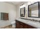 This is a bathroom with a double sink vanity and decorative tile at 7649 W Dahlia Dr, Peoria, AZ 85381