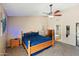 This is a primary bedroom with a spacious layout and attached bathroom at 7649 W Dahlia Dr, Peoria, AZ 85381