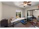 Cozy bedroom with neutral walls, plush carpeting, and ample natural light at 7649 W Dahlia Dr, Peoria, AZ 85381