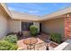 Charming courtyard with a cozy seating area surrounded by well-maintained landscaping and privacy walls at 7649 W Dahlia Dr, Peoria, AZ 85381