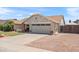 Charming single-story home featuring manicured landscaping, warm exterior lighting, and a two-car garage at 7649 W Dahlia Dr, Peoria, AZ 85381