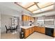 Well-lit kitchen featuring ample cabinet space, updated appliances, and a cozy breakfast nook at 7649 W Dahlia Dr, Peoria, AZ 85381