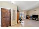 Bright and airy living room with tile floors, large windows, and a warm, welcoming ambiance at 7649 W Dahlia Dr, Peoria, AZ 85381
