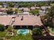 An aerial view of the property shows a private pool, putting green, lush landscaping, and more at 8036 E Mercer Ln, Scottsdale, AZ 85260