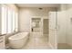Beautiful bathroom with soaking tub, shower, and double sink vanity with great natural light at 8036 E Mercer Ln, Scottsdale, AZ 85260