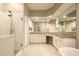 Elegant main bathroom with a large shower, tub, custom mirrors, and double sink vanity at 8036 E Mercer Ln, Scottsdale, AZ 85260