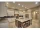 The gourmet kitchen features granite countertops, stainless steel appliances, and a large island at 8036 E Mercer Ln, Scottsdale, AZ 85260