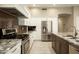 Spacious kitchen with stainless steel appliances, granite countertops, and custom cabinetry at 8036 E Mercer Ln, Scottsdale, AZ 85260