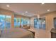 Bright, spacious main bedroom featuring plantation shutters, neutral walls, and outdoor access at 8036 E Mercer Ln, Scottsdale, AZ 85260