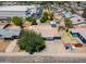 This aerial view showcases a home with a spacious backyard, storage shed and covered patio at 8132 W Pierson St, Phoenix, AZ 85033