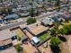Aerial view of the home features a large backyard with covered patio and storage shed at 8132 W Pierson St, Phoenix, AZ 85033