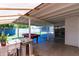 Relax on the spacious covered patio featuring a pool table and outdoor sink at 8132 W Pierson St, Phoenix, AZ 85033