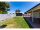 This backyard offers a grassy area and a shed for extra storage at 8132 W Pierson St, Phoenix, AZ 85033