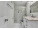 Updated bathroom features marble vanity, sleek shower, modern fixtures and a tile floor at 8132 W Pierson St, Phoenix, AZ 85033