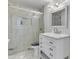 Bright bathroom featuring a glass enclosed shower and vanity with marble countertop at 8132 W Pierson St, Phoenix, AZ 85033