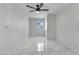 Bedroom featuring a ceiling fan, window, and ample space for furnishings at 8132 W Pierson St, Phoenix, AZ 85033