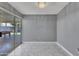 Bright bonus room offering sliding glass door, outdoor views, and stylish, modern tile floors at 8132 W Pierson St, Phoenix, AZ 85033